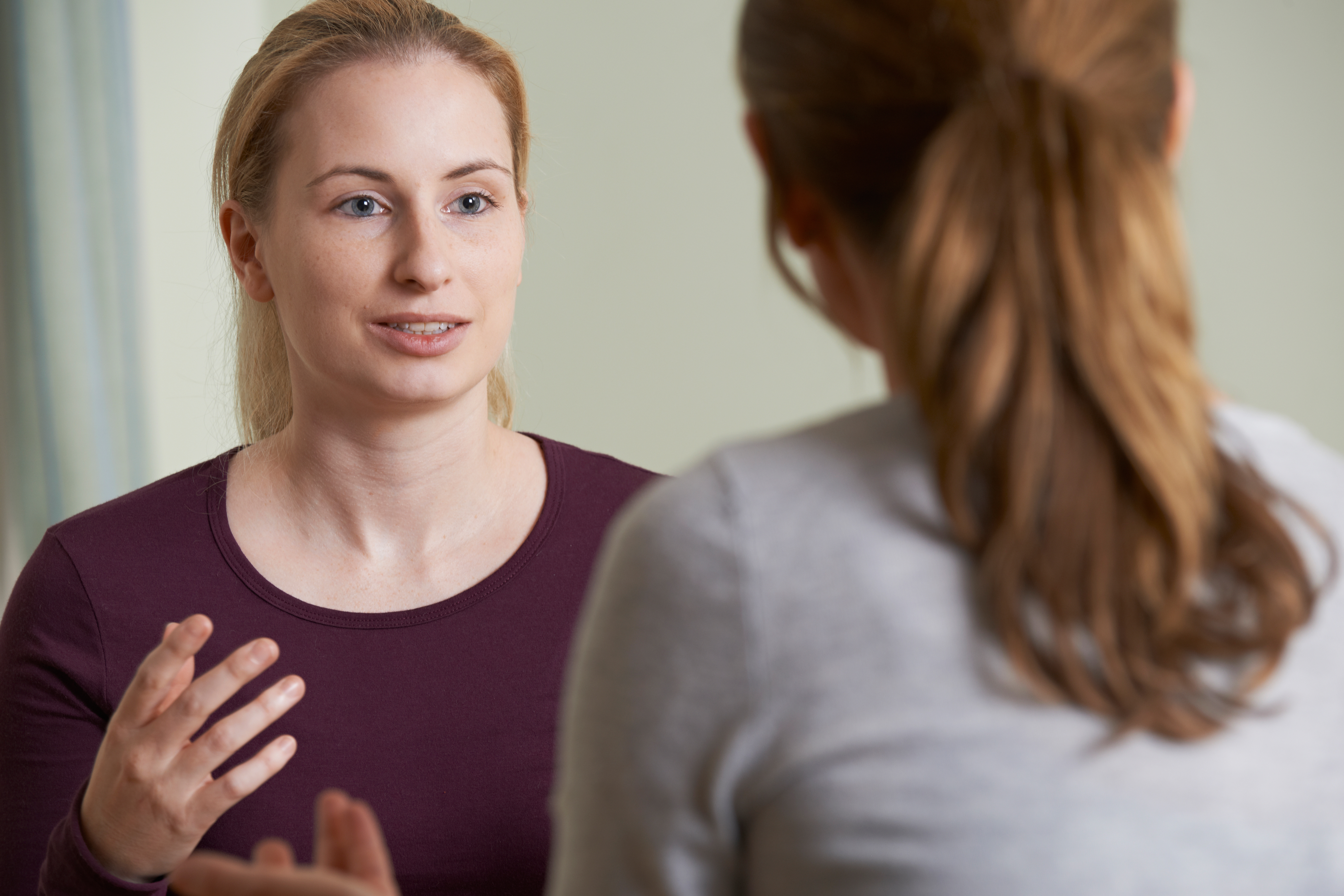 A patient and audiologist in conversation